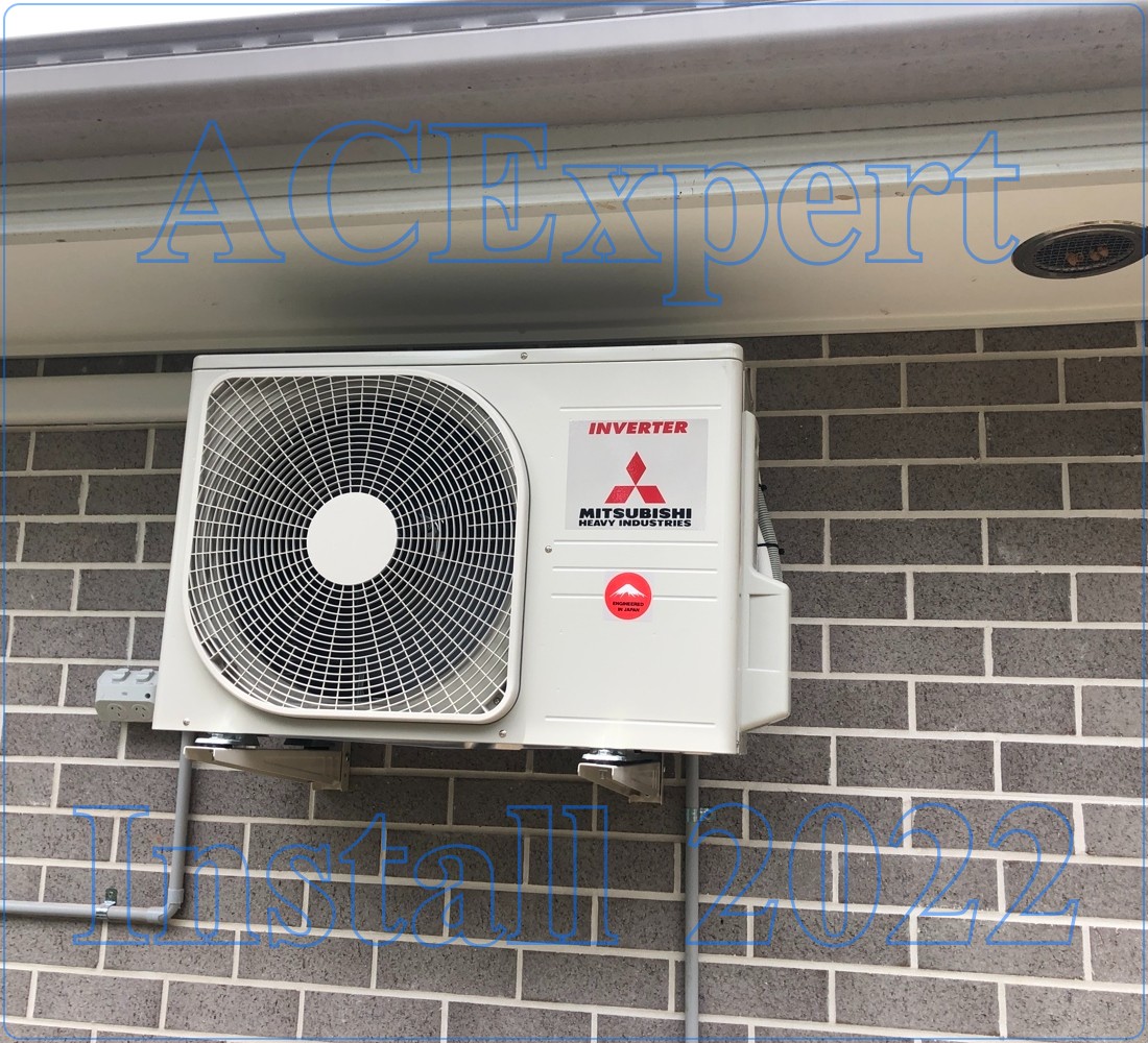 HVAC technician connecting low-voltage control wires to a thermostat base plate indoors