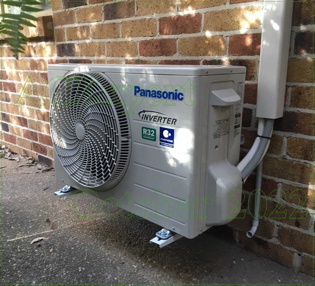 Australian suburban home exterior showing outdoor condenser unit mounted on concrete pads for winter heating