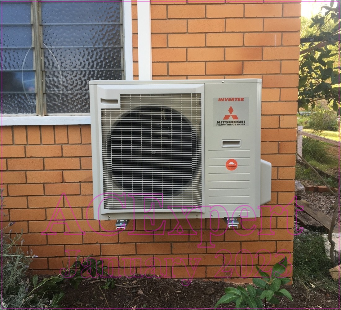 Service van parked outside a suburban home with a technician carrying tools for a tune-up