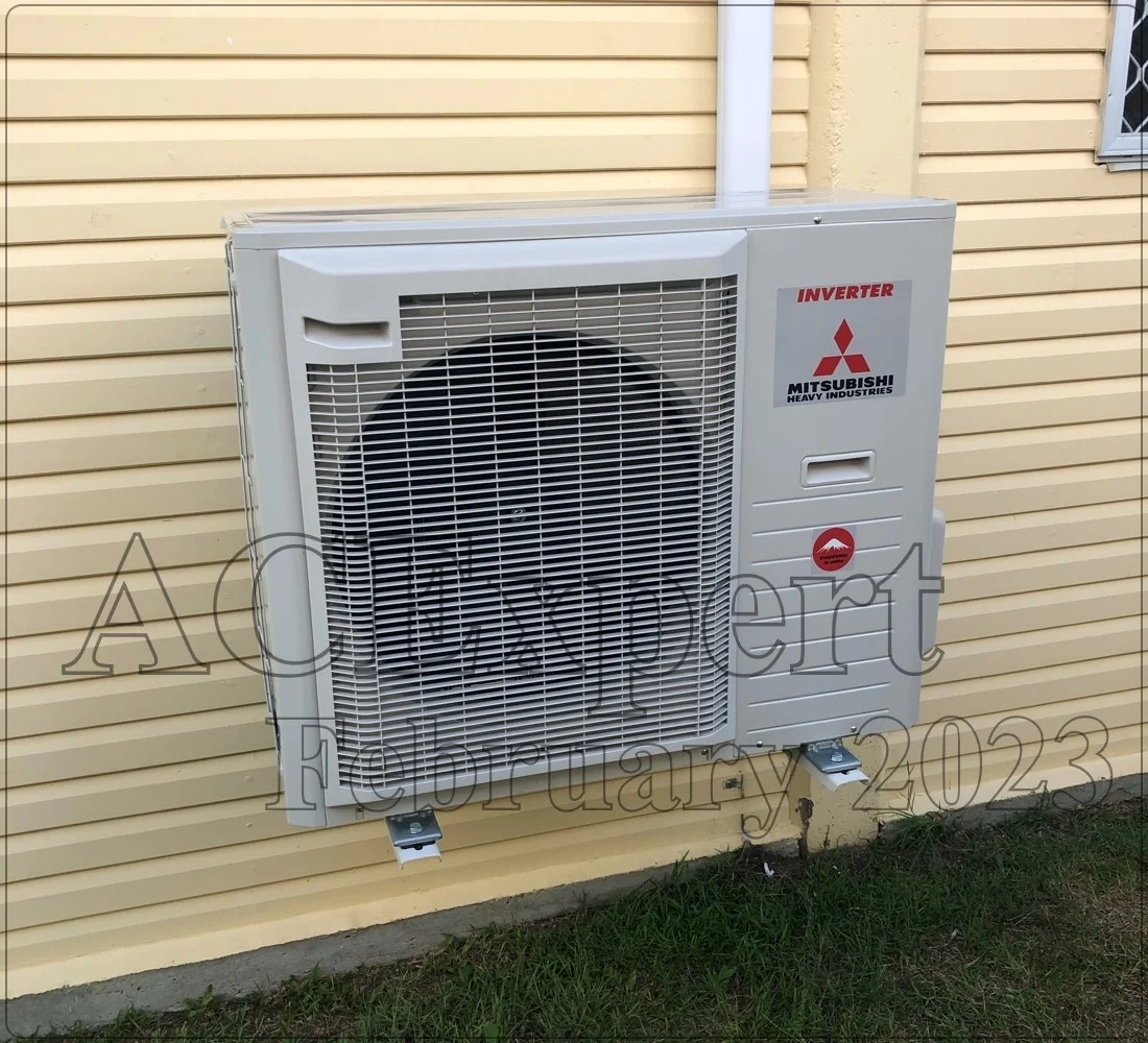 Correct placement of a split system outdoor unit mounted on an exterior wall in Brisbane.