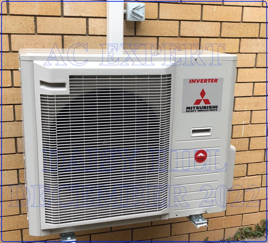 Technician shows how to mount an outdoor unit on a wall with adequate clearance for airflow in a Brisbane property.